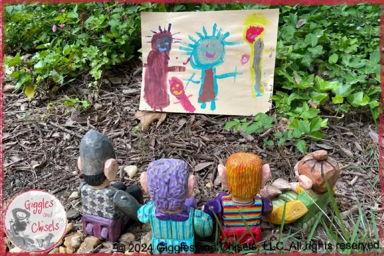 The picture of four wooden puppets, in awe in front of a young child's drawing