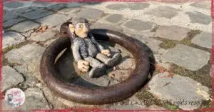 A wooden puppet inside a circle