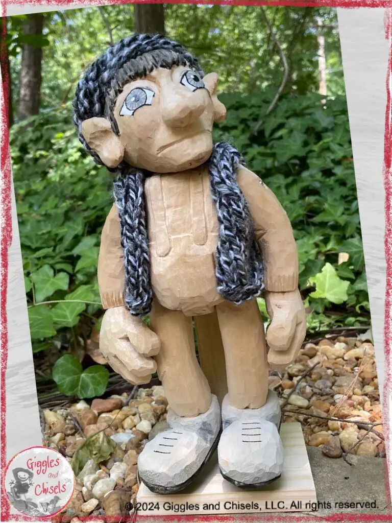 A wooden puppet, looking at the cloud