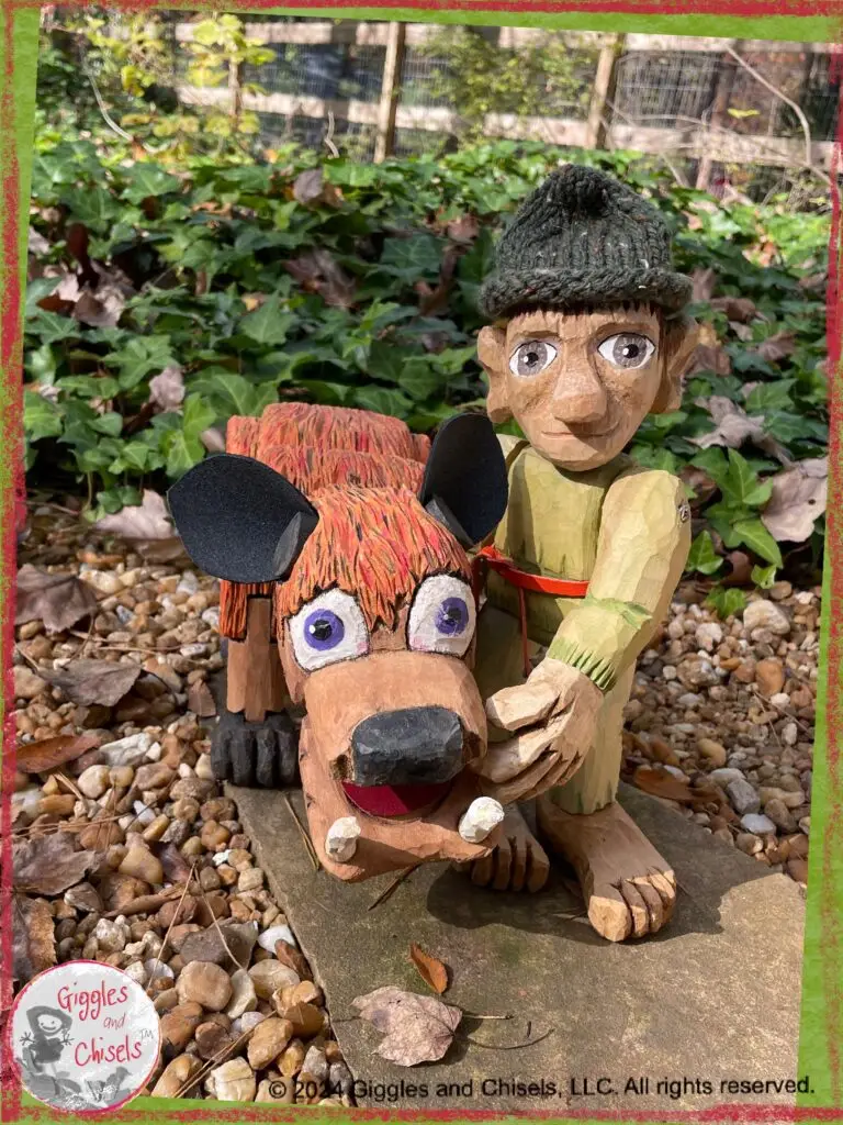 Pierre-Qui-Roule, a wooden puppet in green shades, next to an imaginary animal, with purple eyes, orange fur, and black ears.