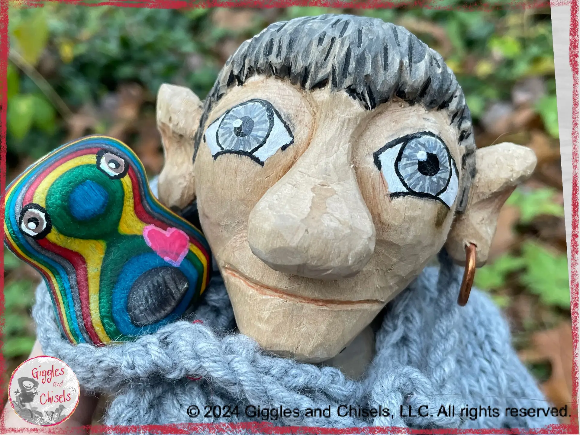 Maurice, a wooden puppet, with a little creature, turned on a lathe, in his hood