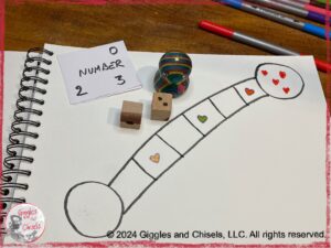 A board game, with a token, two dice, and a set of cards