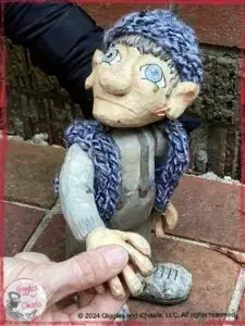 Maurice, a wooden puppet in grey colors