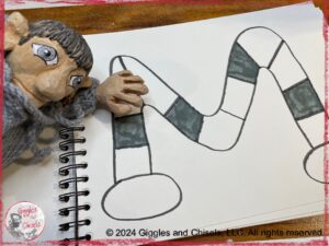 A board game, in the shape of an M