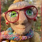 Madame Rigolotte, a wooden puppet in rainbow colors