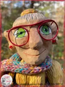 Madame Rigolotte, a wooden puppet in rainbow colors