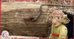 Pierre-Qui-Roule, a wooden puppet, talking a walk outside