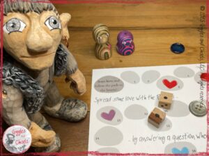 Maurice, a wooden puppet, ready to play a board game.