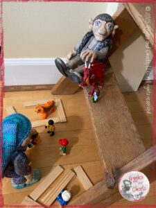 Maurice and Petite Clothilde, two wooden puppets, playing with legos, and other small characters