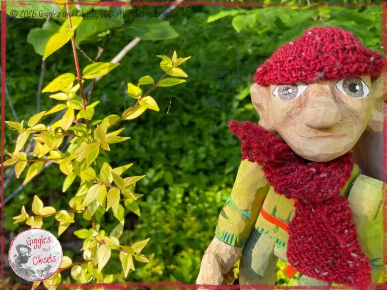 Pierre qui Roule, a wooding puppet, looking a small bush