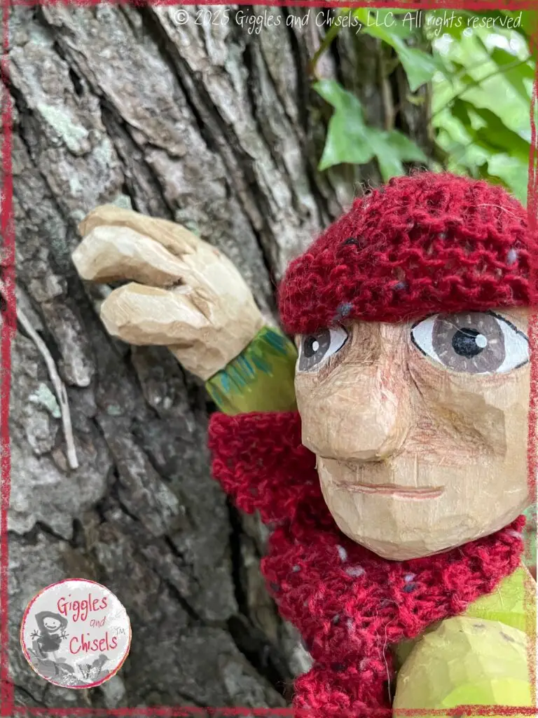 Pierre Qui Roule, a wooden puppet, touching the trunk of a tree