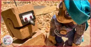 Petite Clothilde, a wooden puppet, with a wooden robot