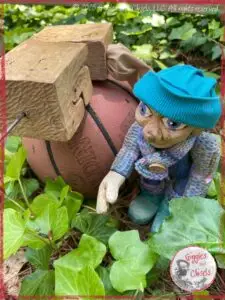 Petite Clothilde, a wooden puppet, playing ball with a robot puppet