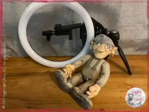Maurice, a wooden puppet, in front of a video light