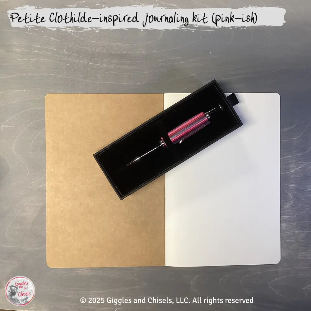 A pink-shade pen and a notebook