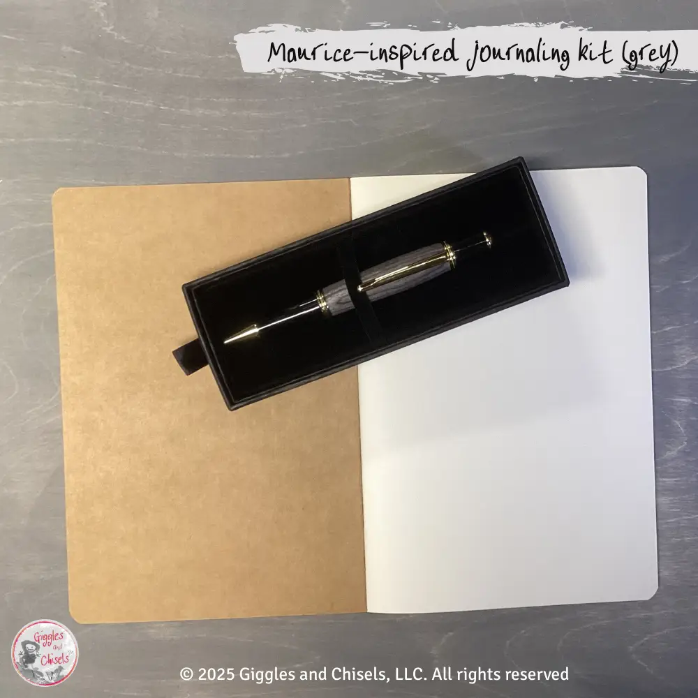 A grey pen and a notebook