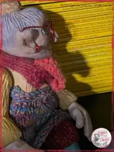 Mme Rigolotte, looking at a pile of national geographic magazines