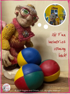 A wooden puppet looking at a set of juggling balls