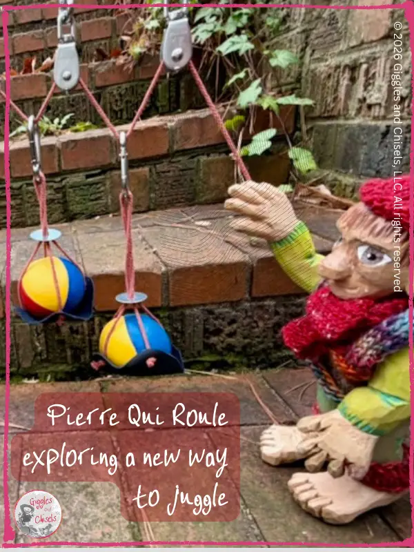 Pierre qui Roule, a wooden puppet, playing with pulleys