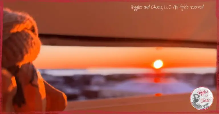 Maurice, a wooden puppet, looking at a sunrise