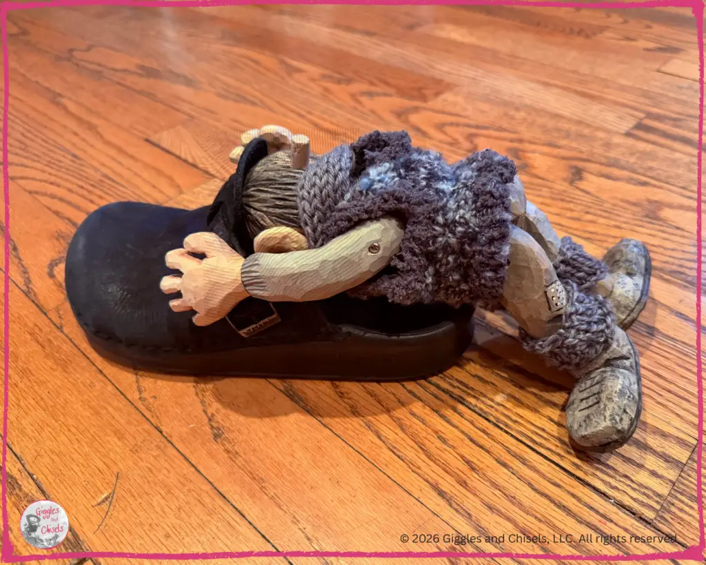 Maurice, a wooden puppet, hiding in a sleeper