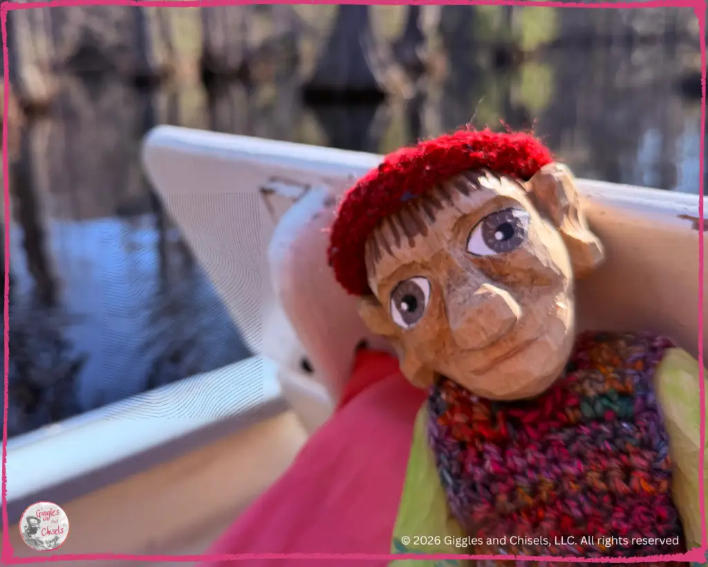 Pierre Qui Roule, a wooden puppet, on a boat
