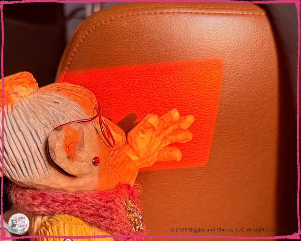 Mme Rigolotte, a wooden puppet, playing with some sun rays