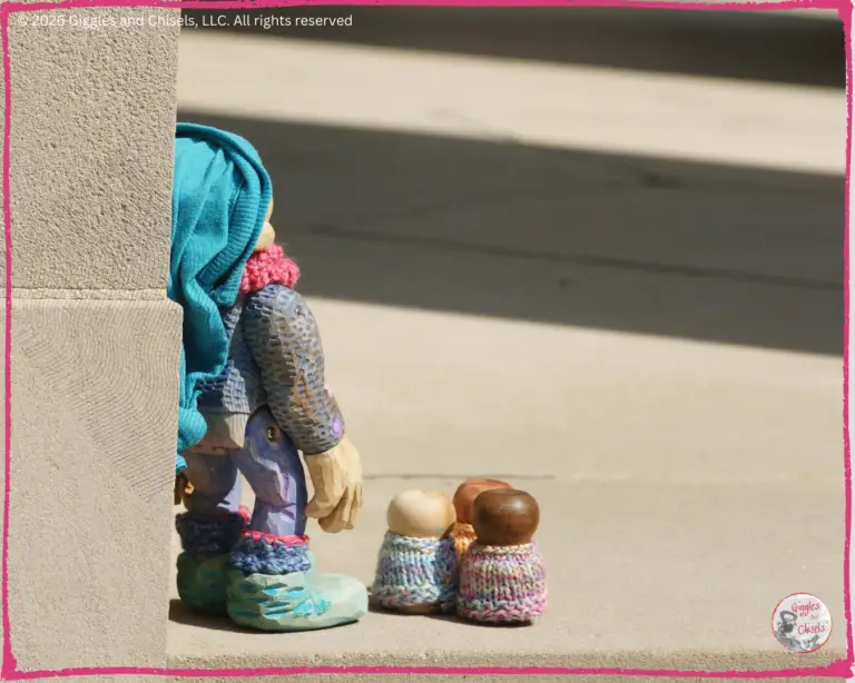 Petite Clothilde, a wooden puppet, with some whimsical charaters, called the Bouilles