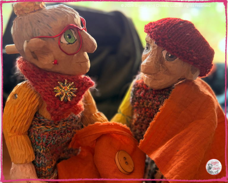 Mme Rigolotte, and Pierre Qui Roule, two wooden puppets, taking some measurement of a shirt