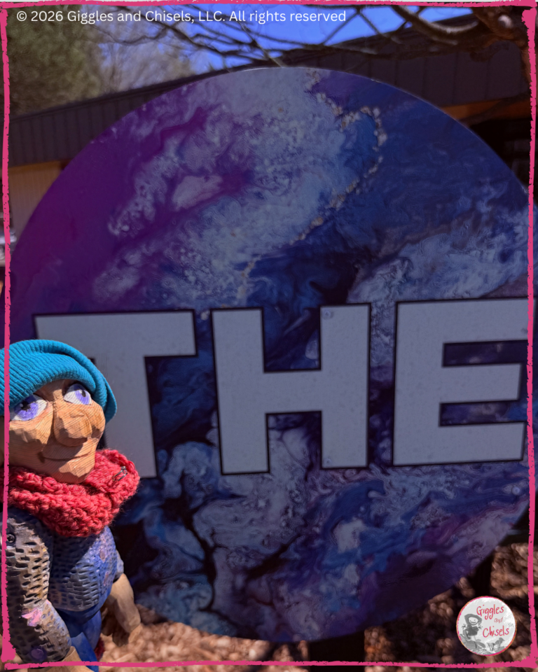 Petite Clothilde, a wooden puppet, in front of circle sign