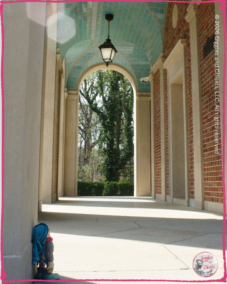 Petite Clothilde, a wooden Fellow, looking at the tiled ceiling at the UNC bell