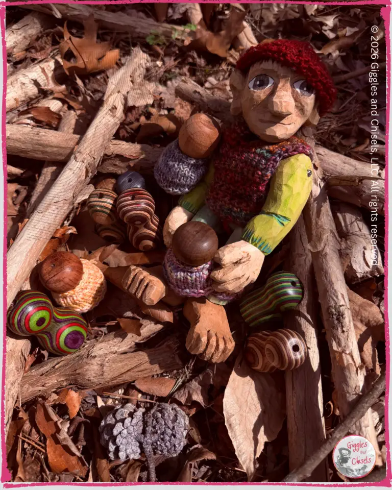 Pierre qui Roule, a wooden puppet, seating on a pile of leaves with some whimsical creatures