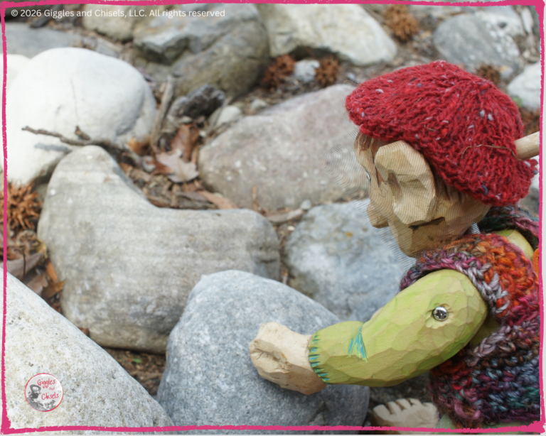 Pierre Qui Roule, a wooden puppet, looking at stripes on a rock