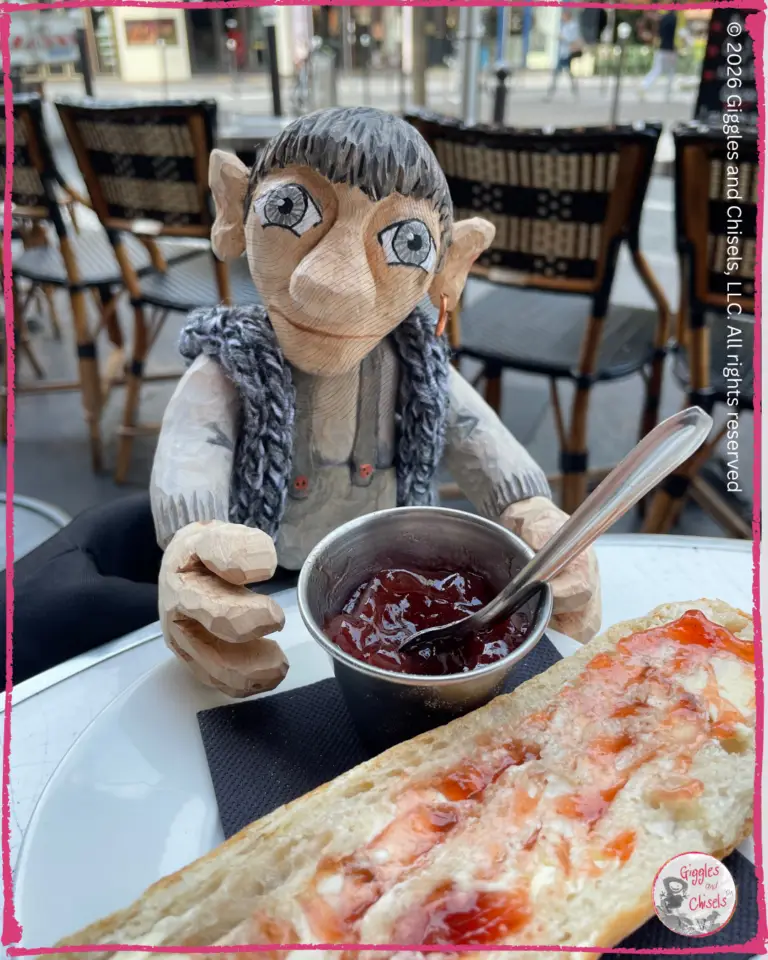 Maurice , a wooden puppet, in front of a French toast