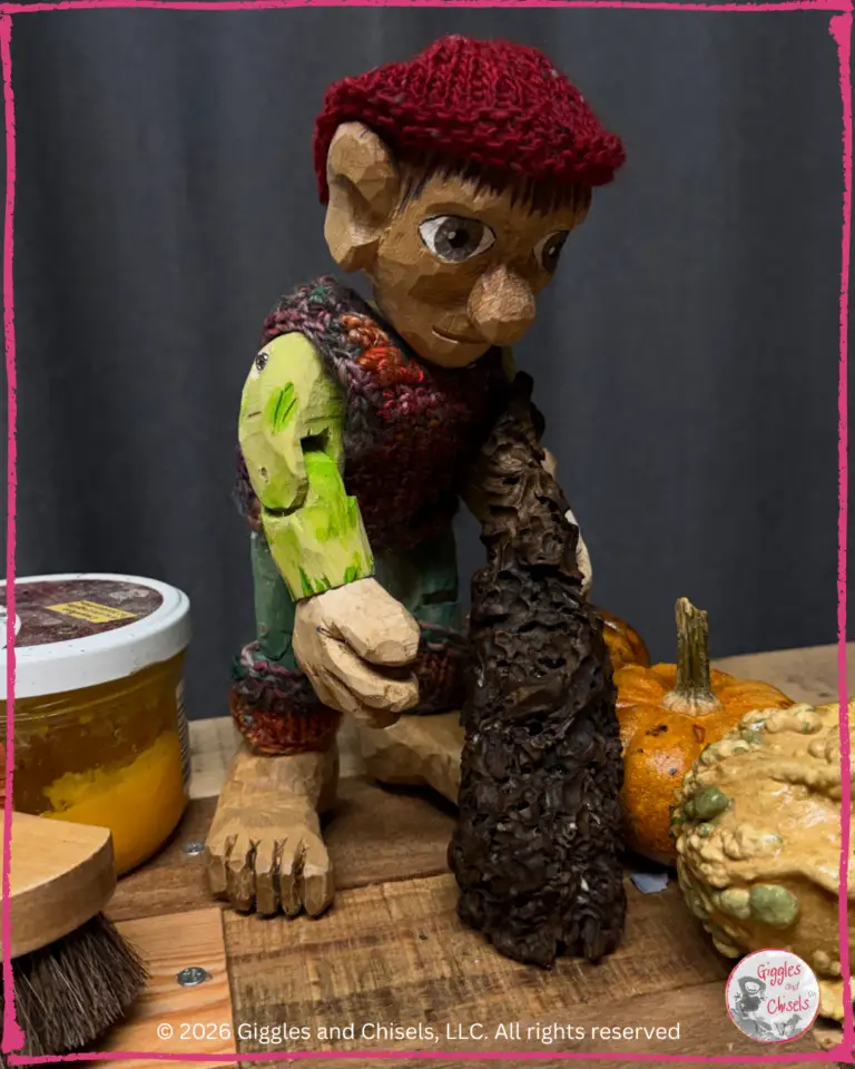 Pierre Qui Roule, a wooden puppet, restoring a piece of driftwood