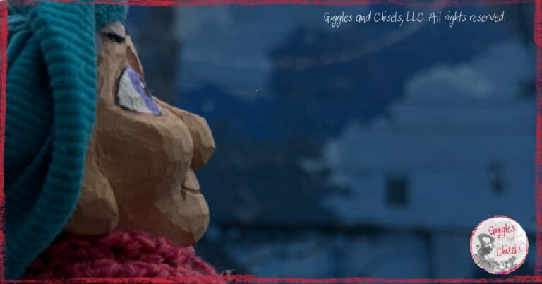 Petite Clothilde, a wooden puppet, in front of a mural