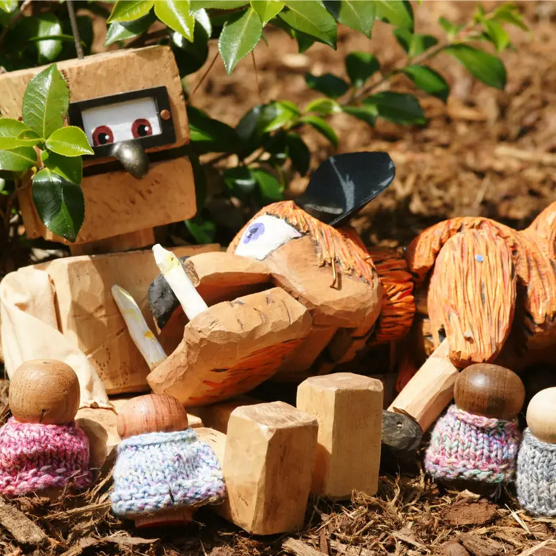 Whimsical wooden puppets, cuddling around