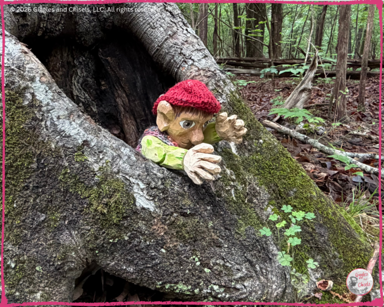 Pierre Qui Roule, a wooden puppet, in a tree trunk