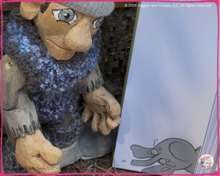 A wooden puppet, looking at a picturebook