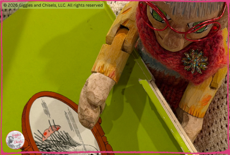 A wooden puppet, looking at a picturebook