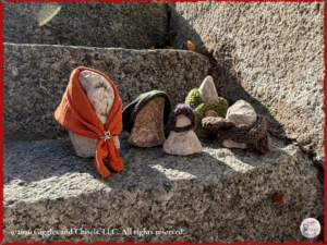 The Douilles, rocks with a hat or a scarf, on a step